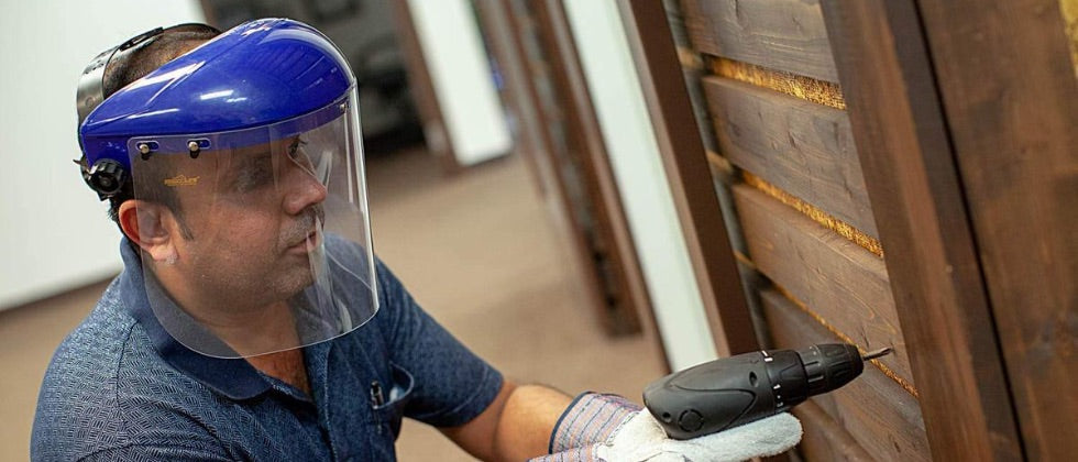 Man wearing a Safe Handler Safety Face Shield